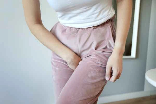 older woman running to the toilet because of urinary incontinence Cheshunt